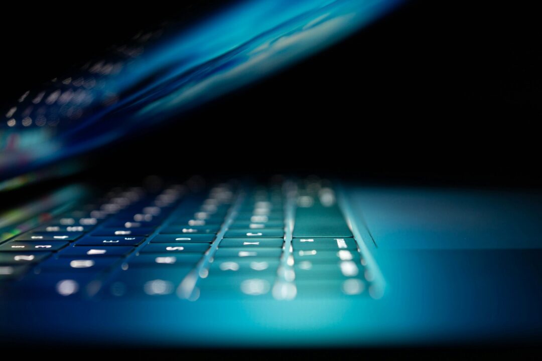 closeup photo of turned-on blue and white laptop computer